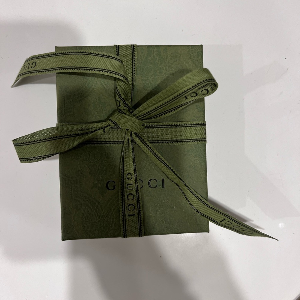 Gucci gift box with ribbon and dustbag. Was for a small wallet. New condition.